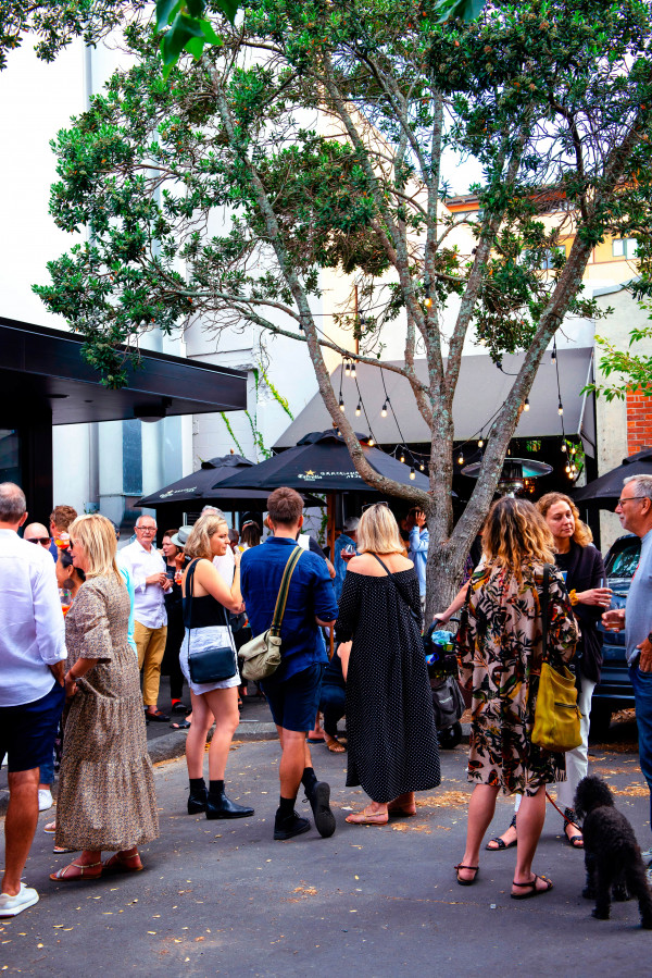 Crowds gather outside dish staff local favourite Barulho, in Auckland suburb Parnell.