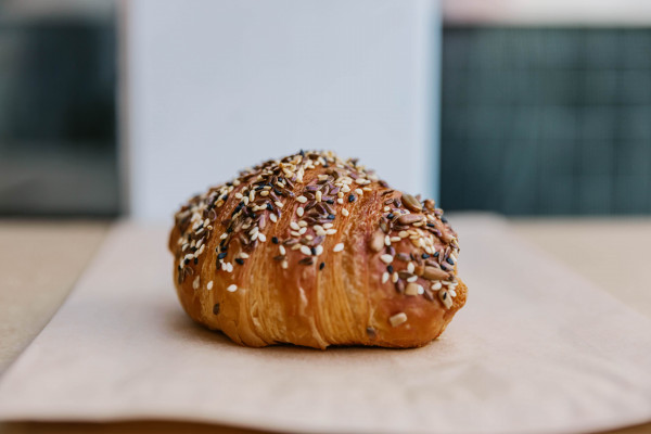 one of the bakery’s ham and cheese croissants.