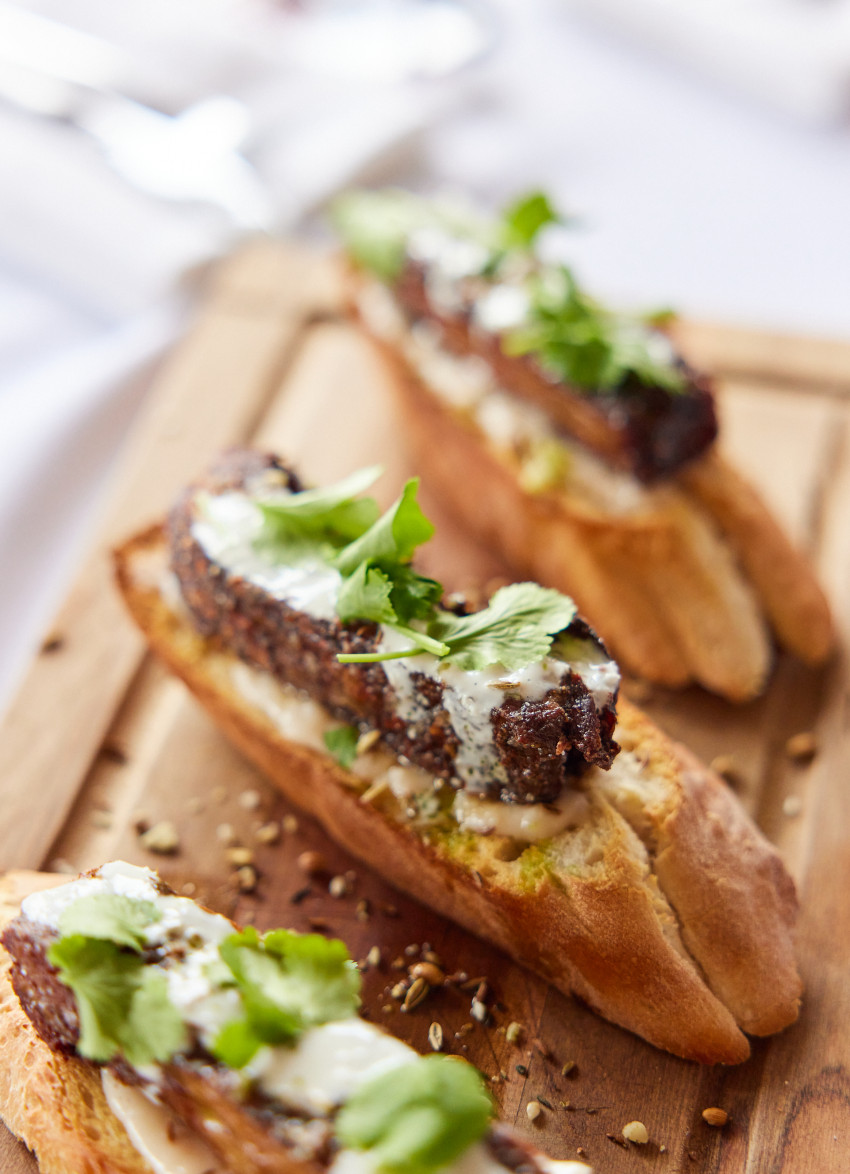 Tunisian Inspired Lamb Ribs, Tahini Yoghurt, Macadamia Dukkah, White Bean Hummus