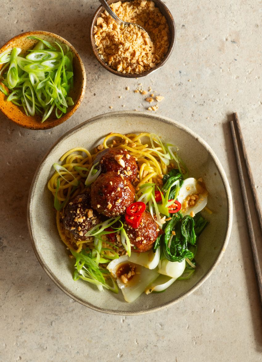 Spicy Hoisin Pork Meatballs served with noodles and bok choy