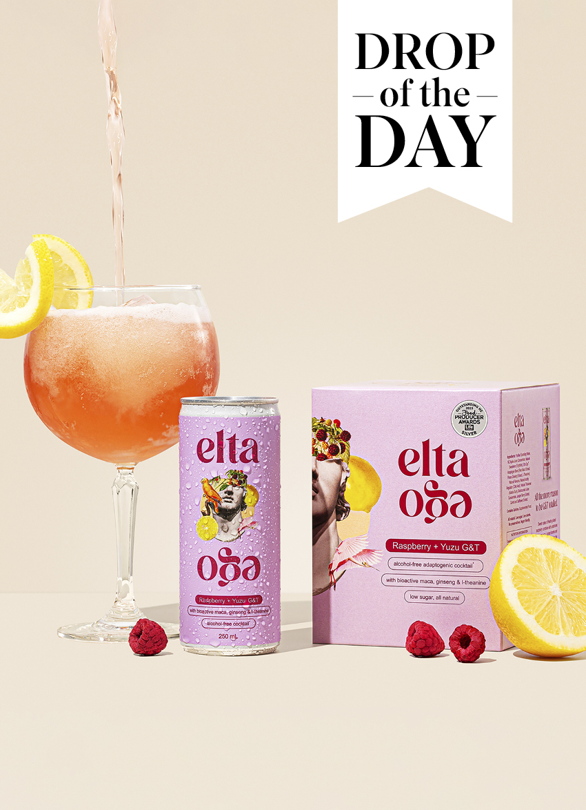 Elta Ego Alcohol-Free Raspberry and Yuzu G&T in glass with fresh raspberries.